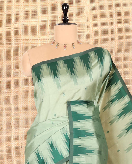 Pista Green Kanchi Silk Saree Highlighted by Thread Buttas All Over Its Body, Complemented by a Contrast Temple Border, Grandly Woven Pallu of Intricate Design Weave, and Paired with a Contrast Blouse