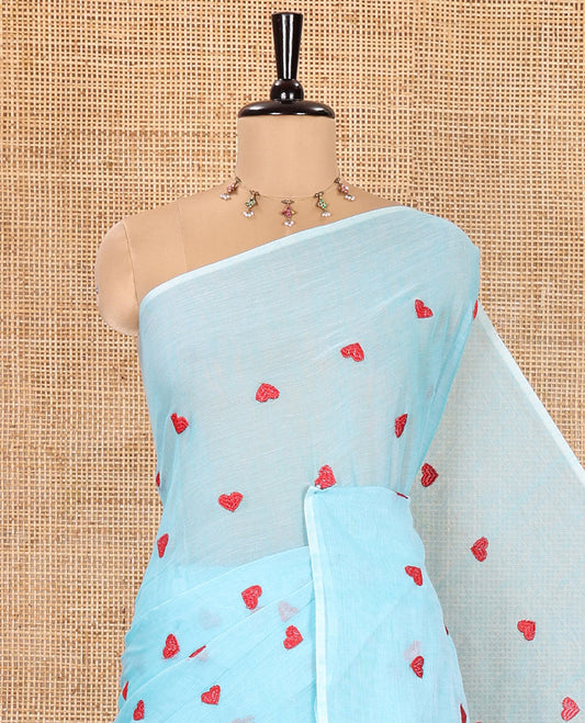 Borderless Sky Blue Khadi Mul Cotton Saree, Artfully Designed with Heart Motifs Embroidery Across Its Body, Pallu mirrors the Same Design, and Paired with a Matching Blouse