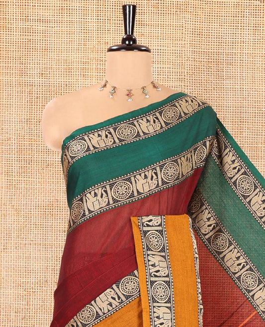 Maroon Plain Mercerised Cotton Saree, Complemented by a Contrast Ganga-Jamuna Rettai Pettu Thread Border of Temple, Elephant, and Chakram Designs, Subtly Striped Pallu, and Paired with a Matching Blouse