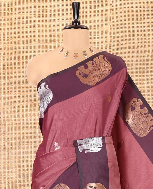 Pink Soft Silk Saree, Enriched With Zari Buttas All Over Its Body, Complemented by Captivating Contrast Border of Elephant Motifs, Grandly Decked Up Pallu, and Paired with a Contrast Blouse