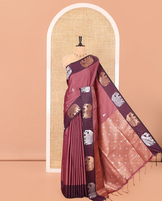 Pink Soft Silk Saree, Enriched With Zari Buttas All Over Its Body, Complemented by Captivating Contrast Border of Elephant Motifs, Grandly Decked Up Pallu, and Paired with a Contrast Blouse