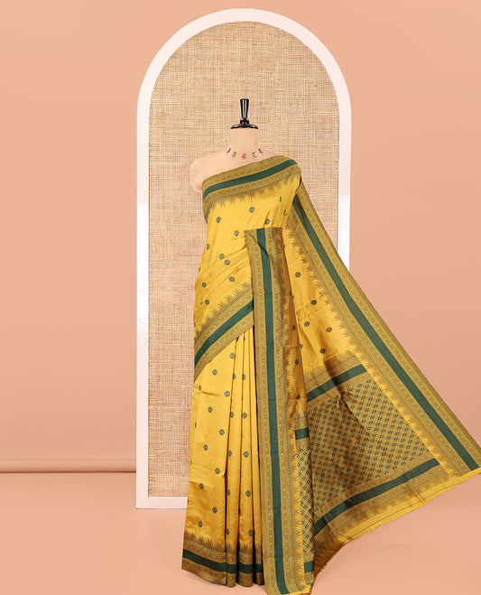 Yellow Kanchi Silk Saree, Subtly Woven with Floral Thread Buttas All Over Its Body, Complemented by a Contrast Border of Temple Traditional Motifs, Jaal Pallu, and Paired with a Matching Blouse