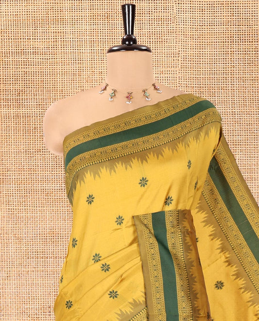 Yellow Kanchi Silk Saree, Subtly Woven with Floral Thread Buttas All Over Its Body, Complemented by a Contrast Border of Temple Traditional Motifs, Jaal Pallu, and Paired with a Matching Blouse