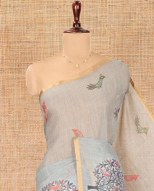 Sage Green Linen Cotton Saree, Steeped in the Richness of Nature-Themed Motifs Like Bird, Owl, and Tree, a Subtle Piping Border, Pallu of Tree Motifs, and Paired with a Matching Blouse