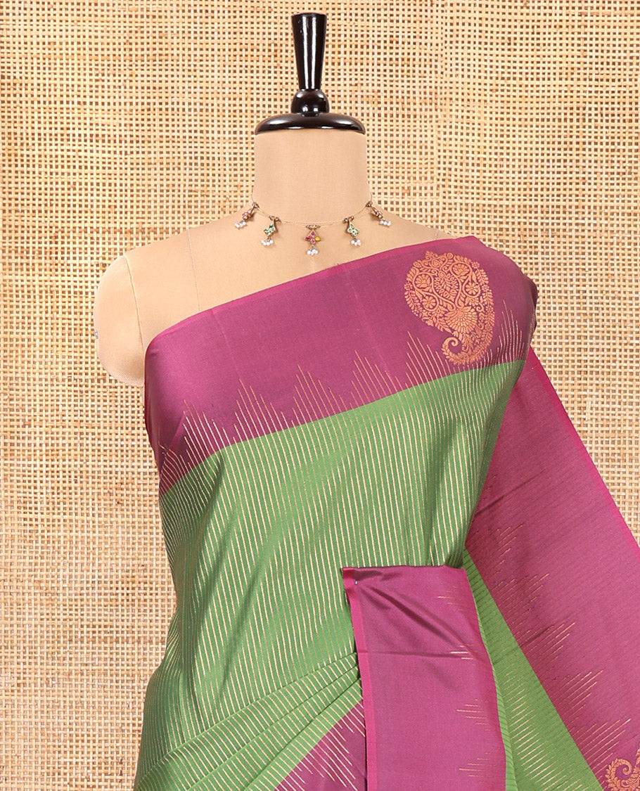 Forest Green Kanchi Soft Silk Saree, Majestically Detailed with Vaira Oosi, and Zari Buttas All Over Its Body, Complemented by Contrast Border of Paisleys, an Intricately Designed Pallu, and Paired with a Contrast Blouse