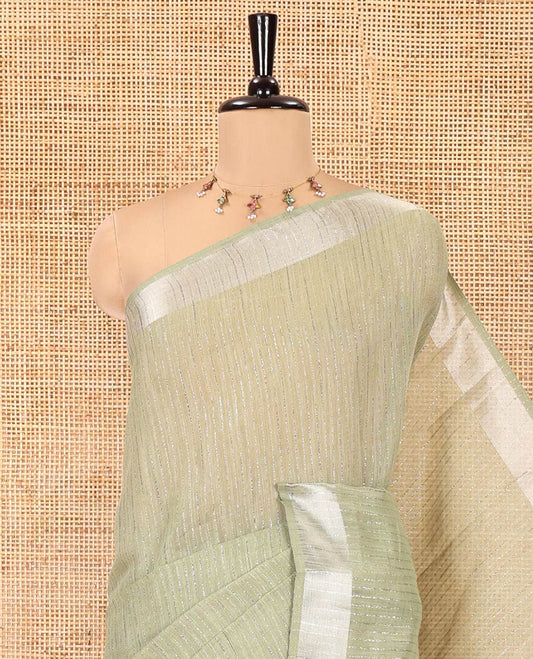 Sage Green Linen Zari Cotton Saree, Gleamed Up with Zari Stripes All Over Its Body, a Subtle Zari Border, a Self-Pallu, and Comes Without a Blouse