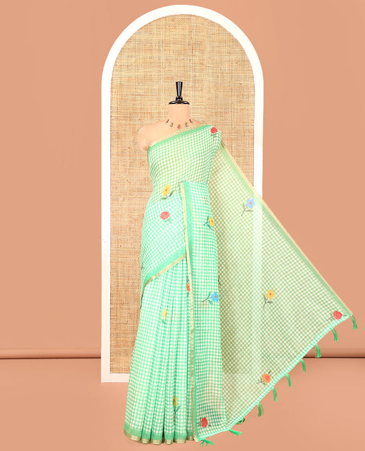 Green Linen Cotton Saree, Elevated with Micro-Checks and Floral Motifs on Its Body, Subtle Piping Border, a Self-Pallu, and Paired with a Rose Floral Printed Blouse