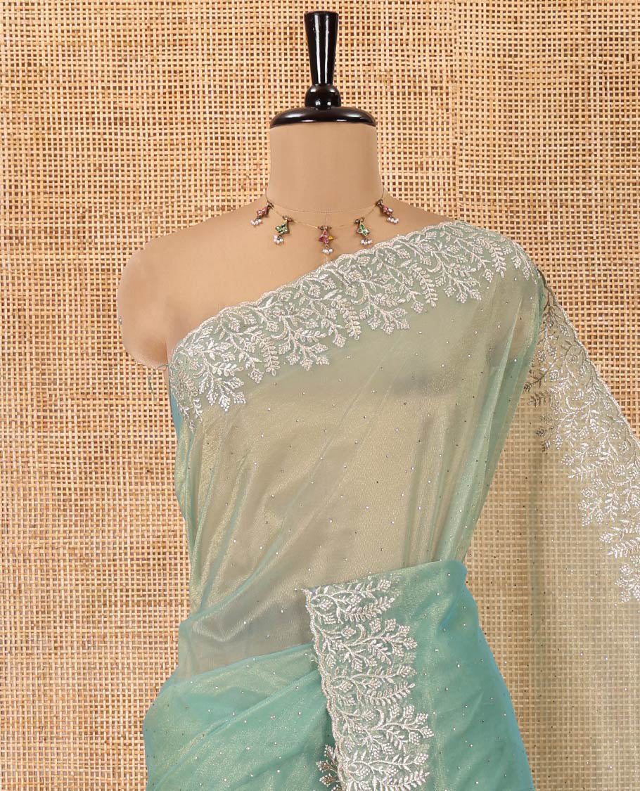 Green Twill Net Saree, Gleamed Up with Stone Work, Highlighted by a Scallop Embroidered Border, and Paired with a Matching Blouse