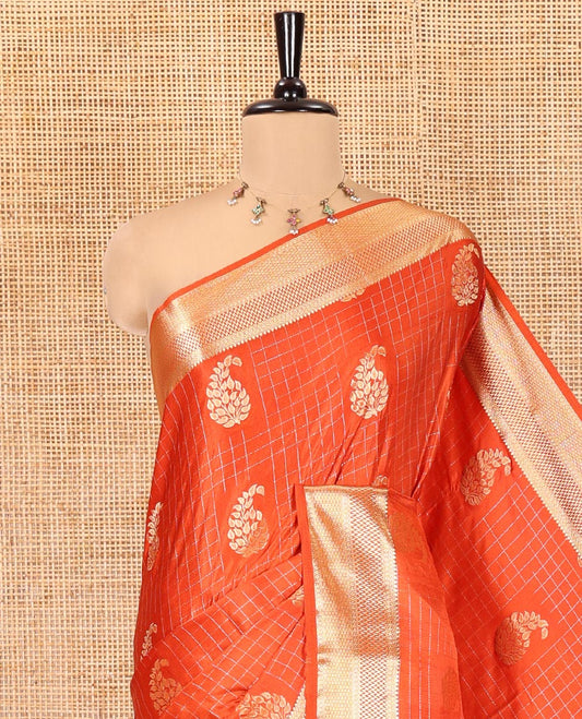 Orange Satin Silk Saree, Enriched with Paisleys and Zari Checked Design on Its Body, Highlighted by Zari Traditional Design Border, Floral Jaal Pallu, and Paired with a Matching Blouse