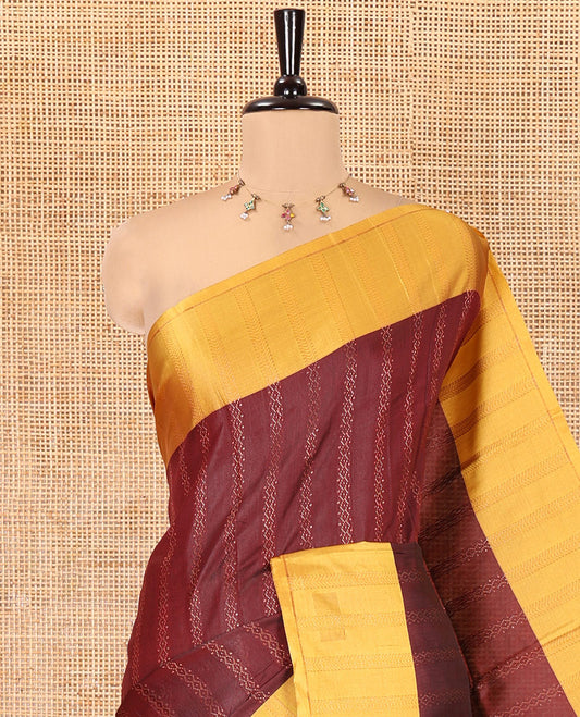 Maroon Kanchi Soft Silk Saree, Enriched with Chevron Stripes on Its Body, Complemented by a Contrast Chevron Striped Border, Striped Pallu, and Paired with a Contrast Blouse