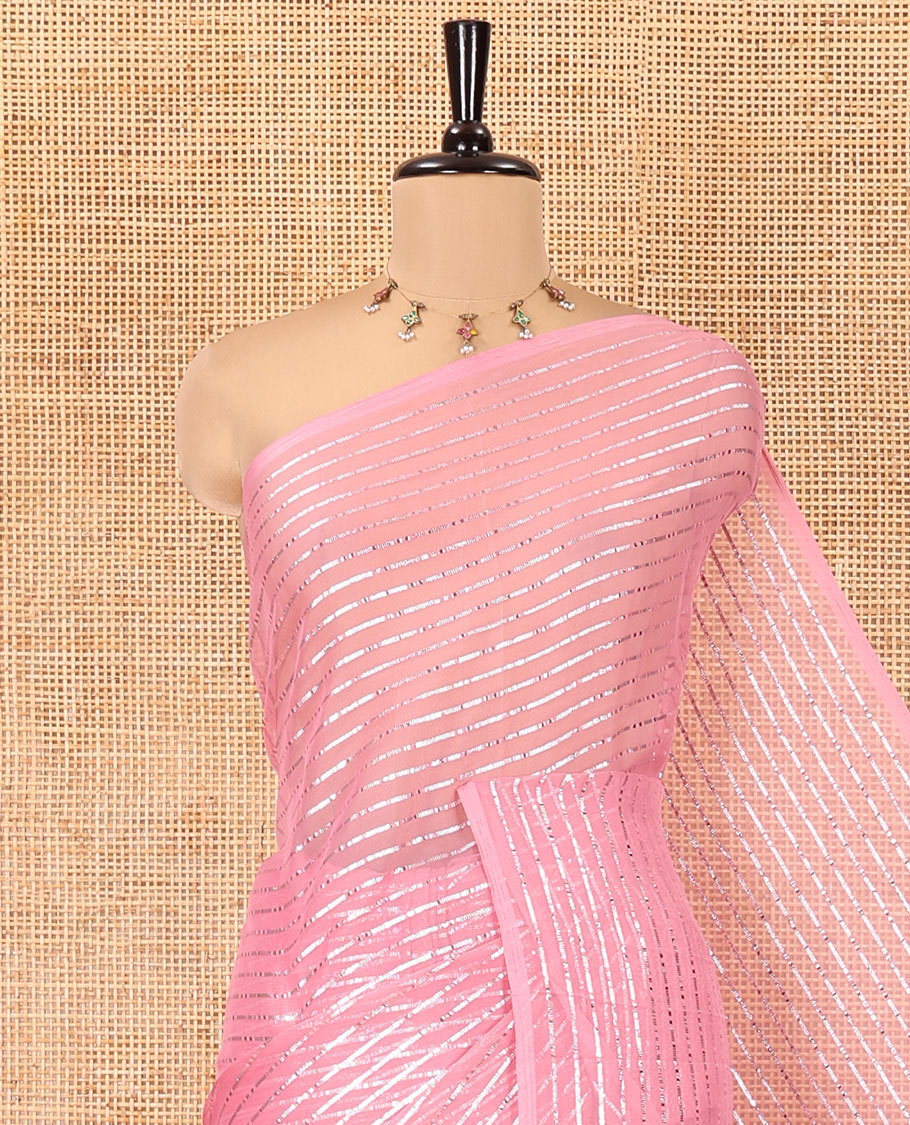 Borderless Onion Pink Chiffon Saree, Gleamed Up with Horizontal Stripes on Its Body, a Self-Pallu, and Has No Blouse