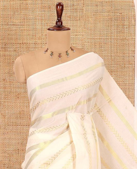 Borderless Cream Kerala Tissue Saree, Richly Detailed with Geometric Zari Stripes, and a Matching Blouse