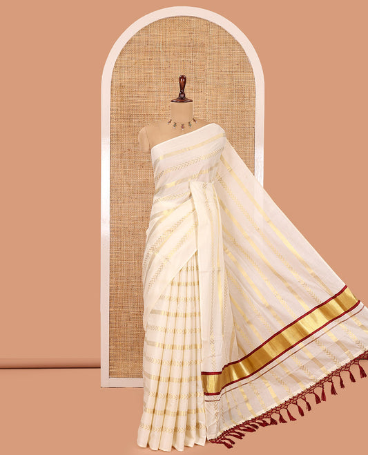 Borderless Cream Kerala Tissue Saree, Richly Detailed with Geometric Zari Stripes, and a Matching Blouse