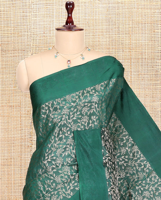 Green Semi-Tussar Saree, Ornamented with Floral Jacquard Design, an Embossed Border, a Floral Pallu, and a Matching Blouse