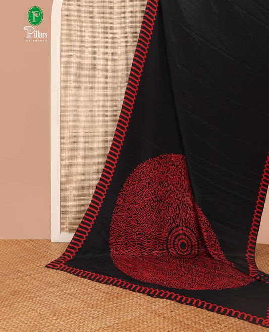Black turkey crepe saree with printed temple border & circle pallu along with butta design blouse