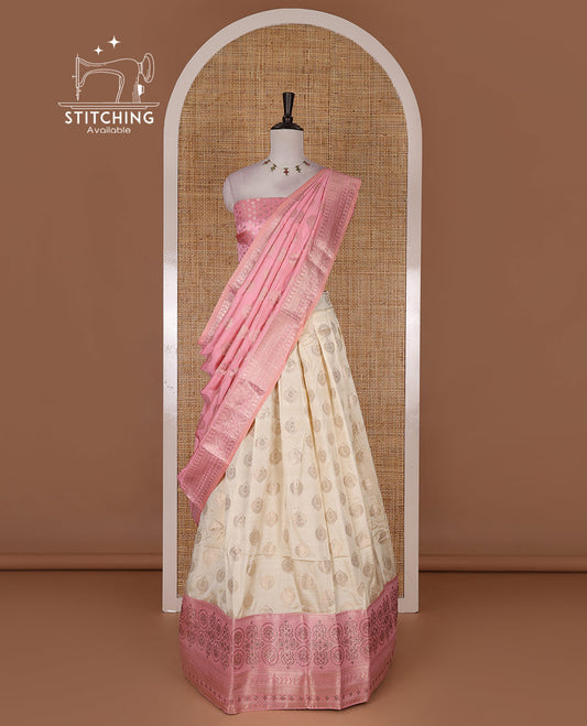 Cream and onion pink semi-banarasi half-saree, zari buttas with contrast swarovski stone work border skirt, contrast zari buttas blouse, and intricate zari dhavani