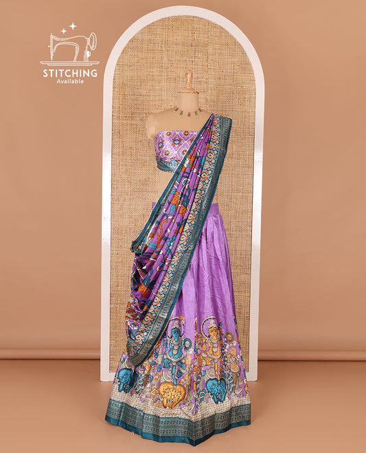 Purple semi-tussar half-saree, kalamkari human figurines printed with a contrast geometric bordered skirt, patola printed blouse, and kalamkari floral vine printed dhavani