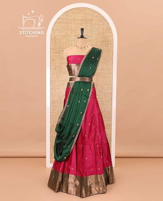 Rani pink taffeta silk half-saree, zari buttas with contrast traditional zari bordered skirt, matching zari design blouse, and contrast scallop buttas embroidered dhavani