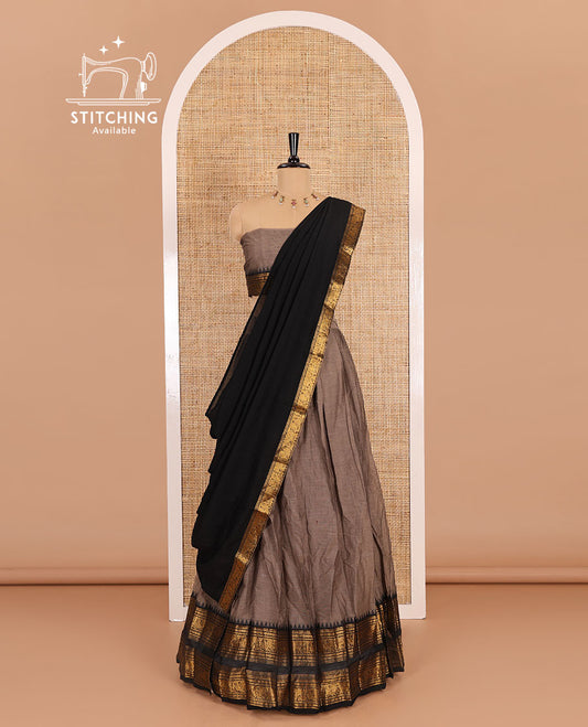Grey-black sungudi cotton half-saree, plain with contrast traditional zari varisai pettu bordered skirt, a matching blouse, and a zari bordered dhavani