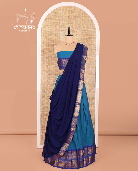 Blue Chettinad Cotton Half-Saree Featuring a Plain Skirt, Highlighted with a Contrast Peacock-Elephant Motifs Woven Rettai Pettu Zari Border, a Subtly Woven Matching Blouse, and a Vichitra Silk Contrast Traditional Zari-Bordered Dhavani