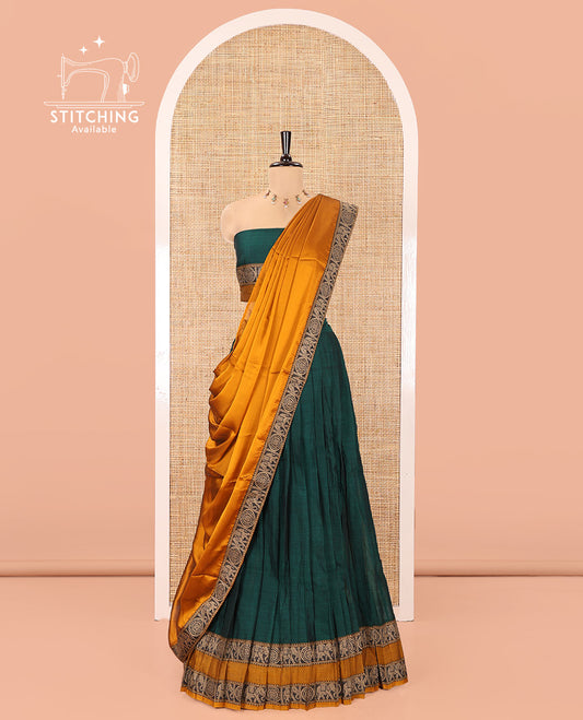 Bottle Green-Mustard Mercerised Cotton Half-Saree Features Plain with Contrast Rettai Pettu Elephant-Chakram Bordered Skirt, Paired with a Matching Blouse, and Comes with a Contrast Elephant-Chakram-Bordered Dhavani
