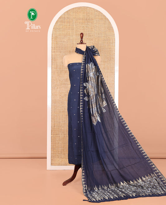 Blue Semi-Silk Material Churidar Features Zari Buttas Skirt, a Plain Bottom, and a Floral Motif Zari Woven Dupatta