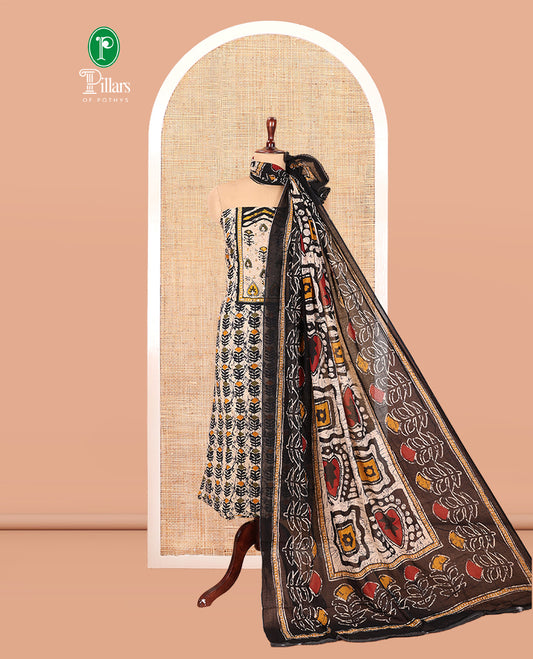Black-Yellow Cotton Material Chudidar Features Batik-Printed Top, a Contrast-Printed Bottom, Batik-Printed Dupatta