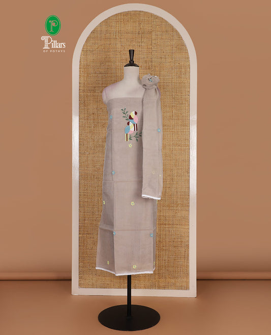 Light grey net kota material chudidar set, macaw parrot, and flower motifs, multi-color sugar bead embroidered top, plain santoon bottom, and sugar bead embroidered dupatta
