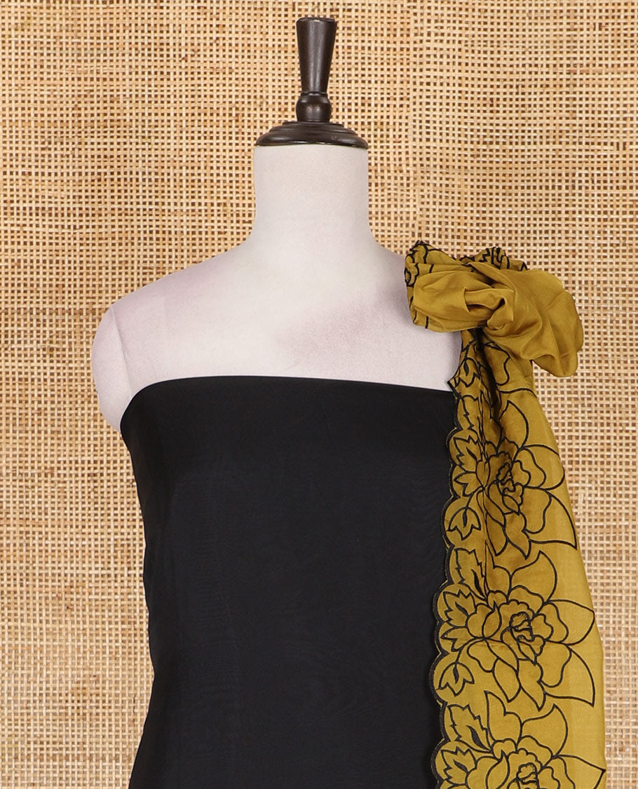 Black and yellow organza material churidar set, Lucknowi chikankari floral vine embroidery top, plain bottom, and contrast floral embroidery dupatta