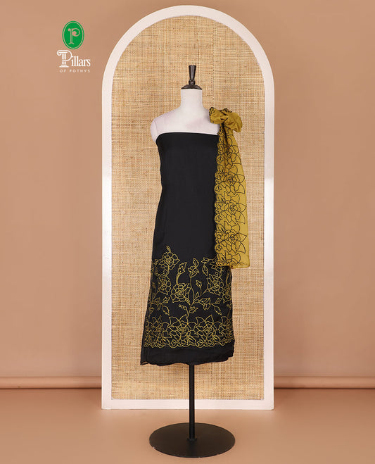 Black and yellow organza material churidar set, Lucknowi chikankari floral vine embroidery top, plain bottom, and contrast floral embroidery dupatta