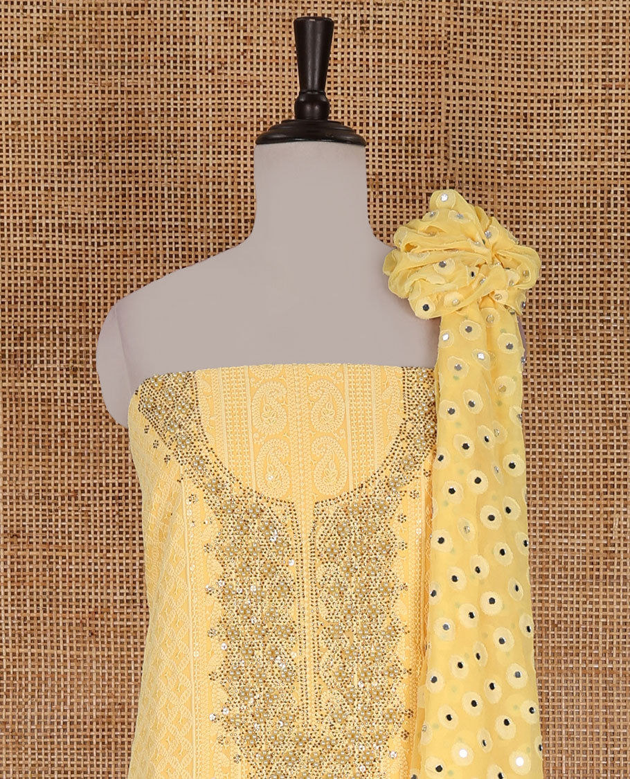 Yellow material churidar set, stone work with Schiffli style embroidered georgette top, American Crape bottom, and polka dotted printed mirror work dupatta