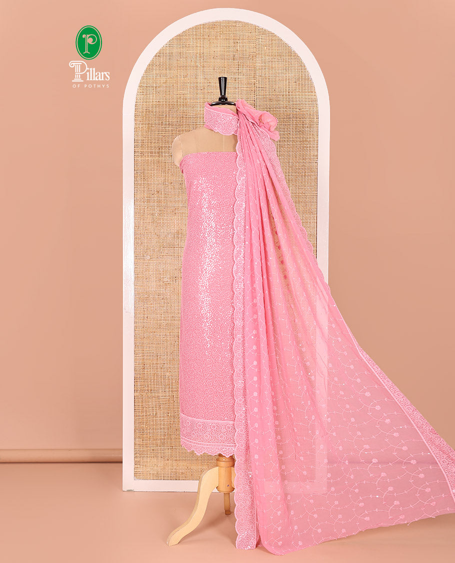Pink Material Chudidar Set Features Sequin Embroidered Georgette Top, a Plain American Crepe Bottom, and a Scallop Dupatta Embellished with Floral Vine Embroidery
