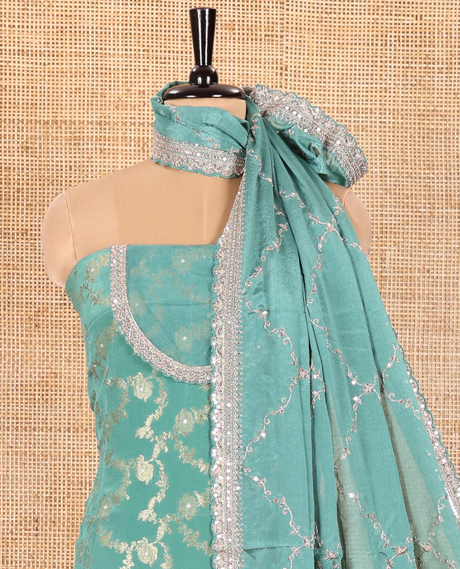 Light Rama Green Chudidar Set Artfully Detailed with Floral Jaal Jacquard Design and Embroidered Viscose Chinon Unstitched Top, Readymade Free Size Chinon Sharara Pants, and a Chinon Embroidered Scallop-Bordered Dupatta