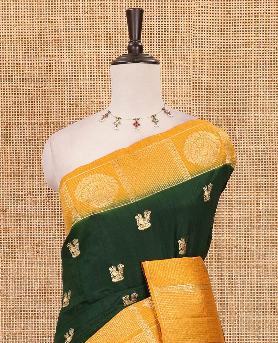 Bottle green peacock buttas dola silk saree, contrast kanchipuram-style traditional zari border, zari pallu & contrast zari border blouse