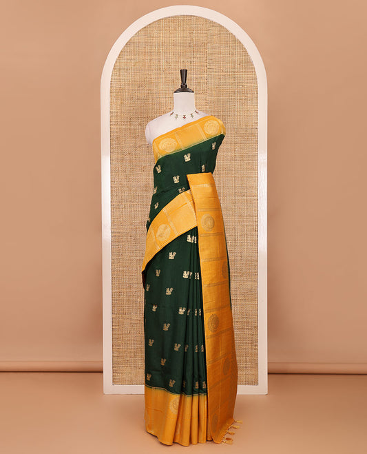 Bottle green peacock buttas dola silk saree, contrast kanchipuram-style traditional zari border, zari pallu & contrast zari border blouse