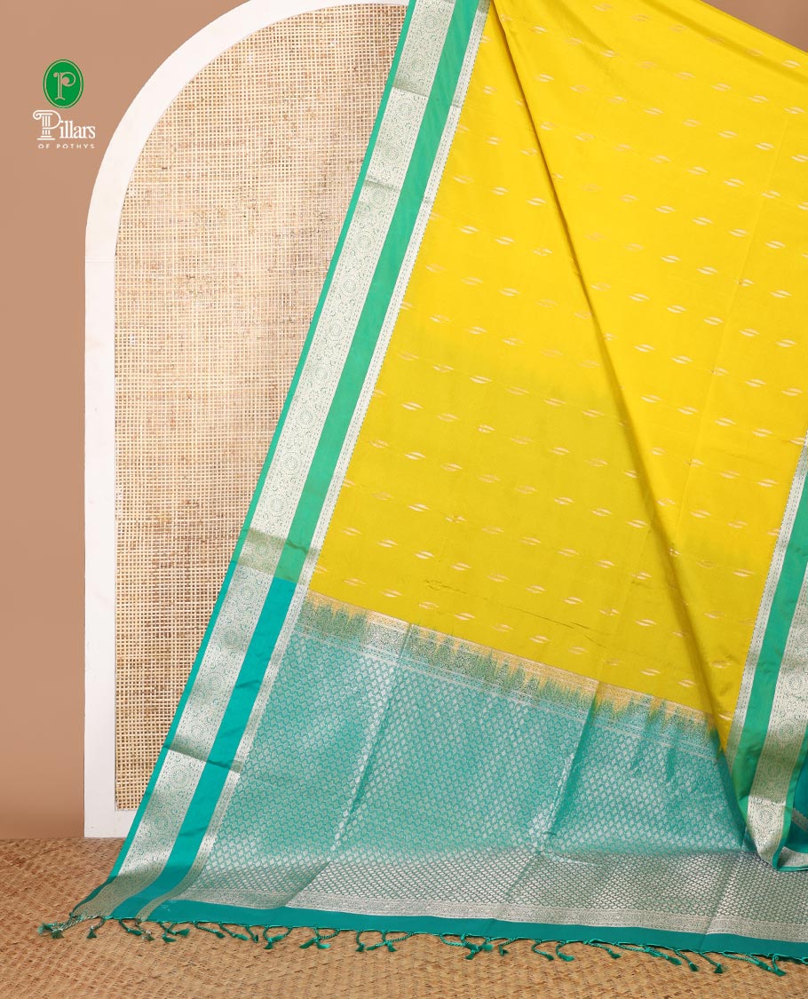 Lemon yellow zari butta semi soft silk saree with rettai pettu, diamond border grand pallu along with plain blouse