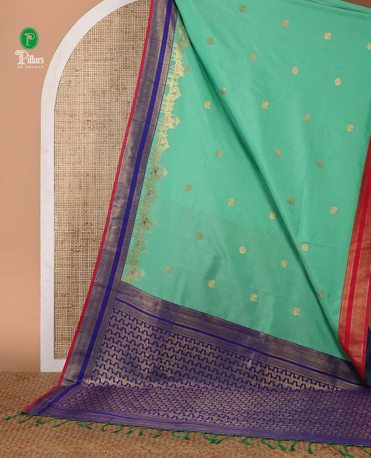 Green mayil chakra & wedding-themed motifs semi-soft silksaree,contrast ganga jamuna rettai pettu traditional border & grand pallu