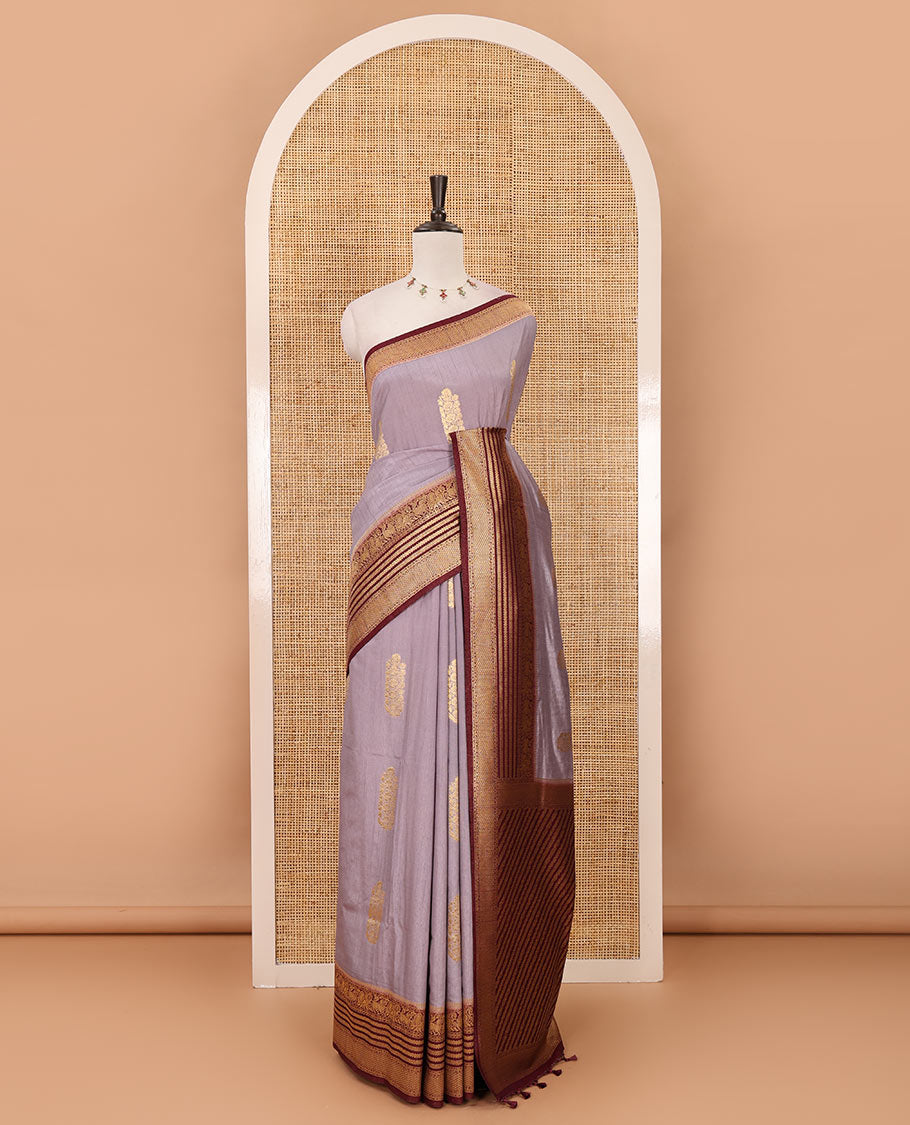 Light lavender floral zari buttas dola silk saree, contrast traditional zari peacock border, diagonal floral zari striped pallu & contrast jacquard blouse
