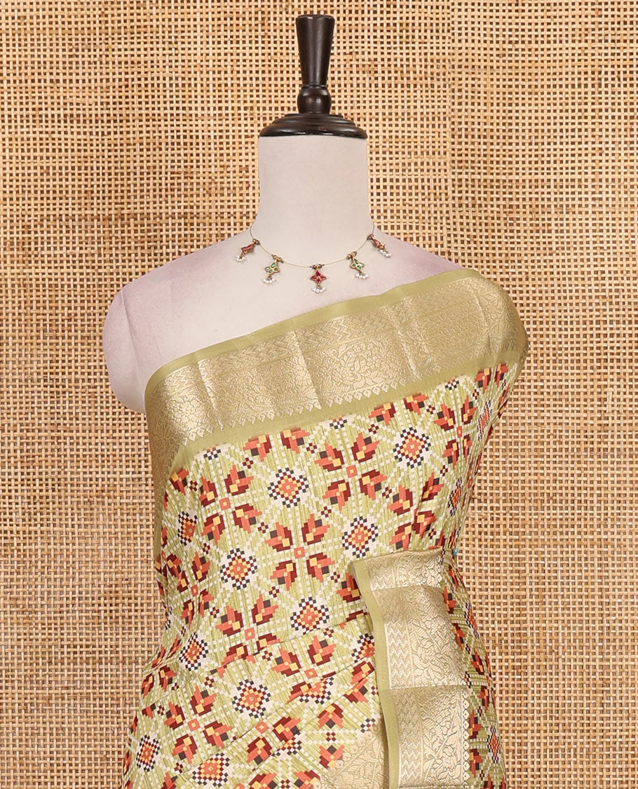 Light mehendi green patola style printed fancy tussar saree, traditional zari border, intricately zari woven pallu and printed blouse