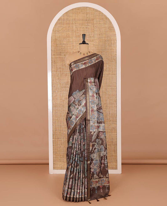 Brown kalamkari human figurines printed fancy tussar saree, floral printed border, human figurines printed pallu, and a matching blouse