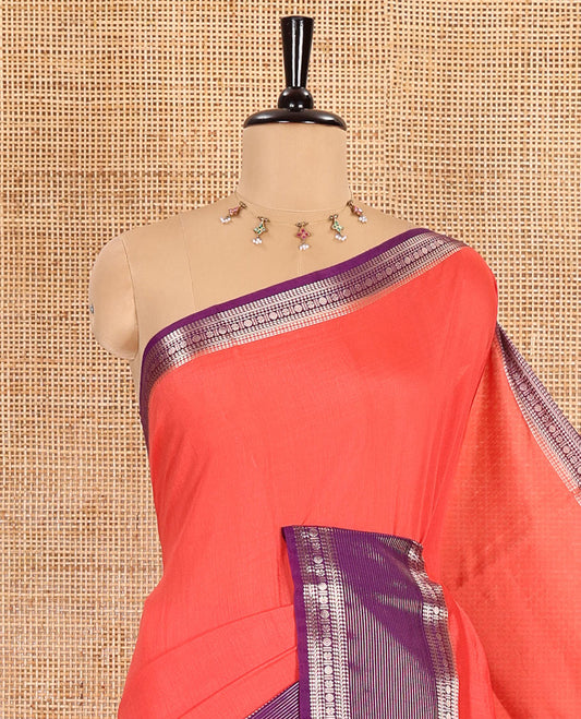 Carrot pink plain Assam silk saree, contrast traditional zari border of rudraksham motifs, zari striped pallu, and a contrast zari bordered blouse