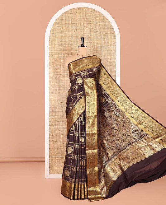 Brown Kanchipuram budget silk saree artfully woven with chakram zari butta enclosed checks all over its body, complemented by zari traditional design border, Mughal-style intricately woven pallu, and paired with a Matching blouse