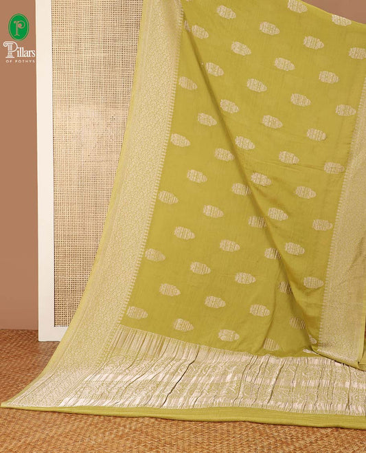 Mustard banaras zari buttas banaras crepe saree with leaf zari design border & rich pallu along with butta design blouse