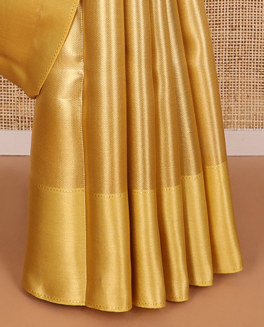 Yellow chevron design tissue saree with contrast striped border & zari design pallu
