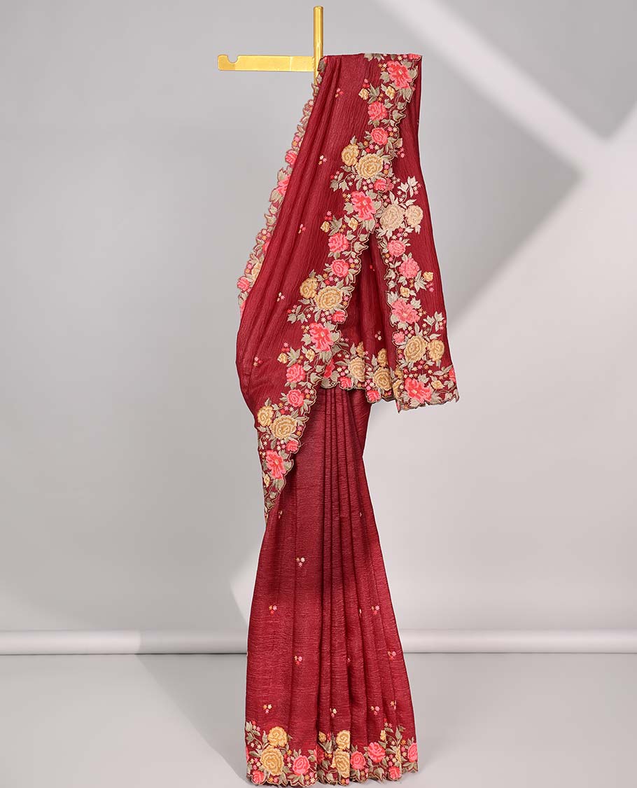 Maroon crushed tissue saree with all over floral motifs & floral scallop border