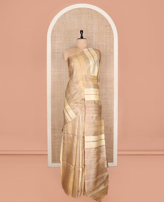 Sandal Tussar Silk Saree, Gleamed Up with Zari Stripes, a Subtle Border, Pallu of Stripes, and a Matching Blouse
