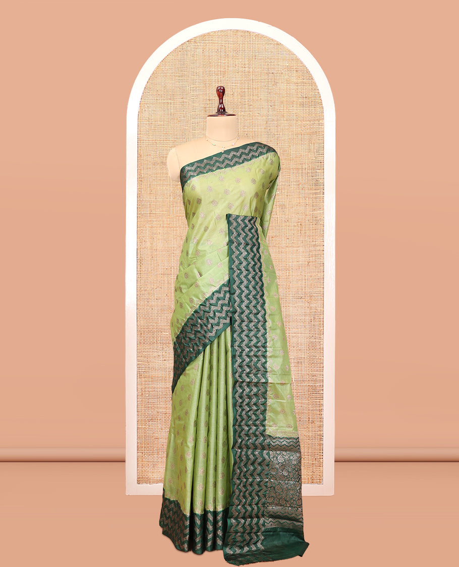 Green Tussar Silk Saree, Woven with Zari Buttas, a Contrast Chevron Zari Design Border, Floral Design Pallu, and a Contrast Blouse