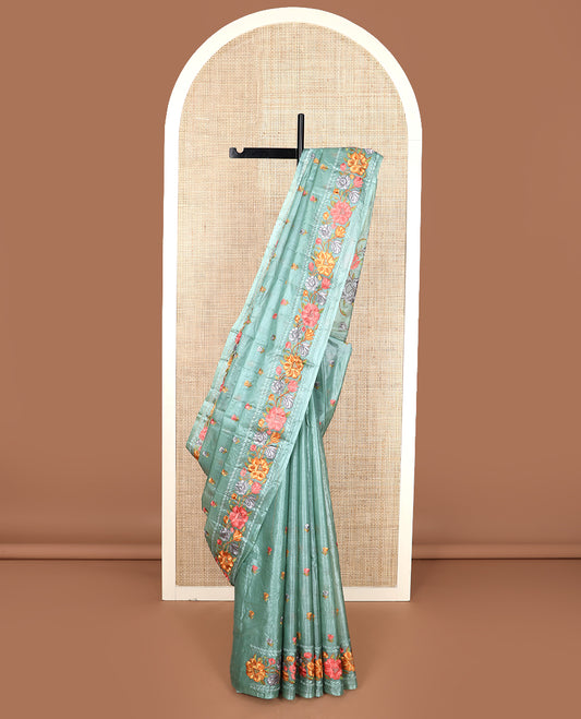 Green floral motifs, multi-color thread embroidered tussar saree, floral vine thread embroidered border, and pallu
