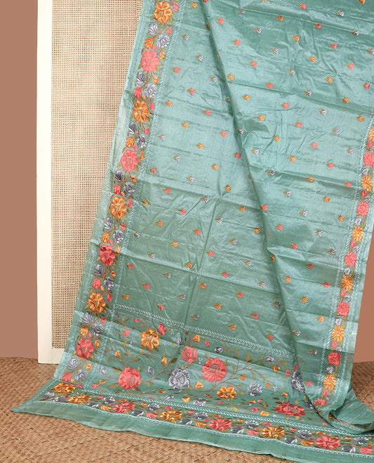 Green floral motifs, multi-color thread embroidered tussar saree, floral vine thread embroidered border, and pallu