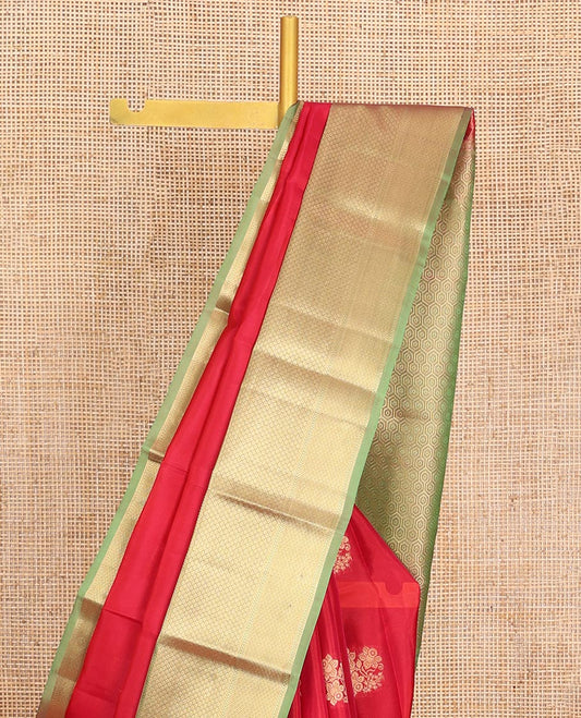 Red Vasundhara Lite-Silk Mix Saree, Prettified with Floral Zari Buttas All Over Its Body, Complemented by a Contrast Border Featuring Rekku, Kathir, Ara Maadam, and Hexagon Designs, Grand Pallu of Geometric Patterns, and Paired with a Contrast Blouse